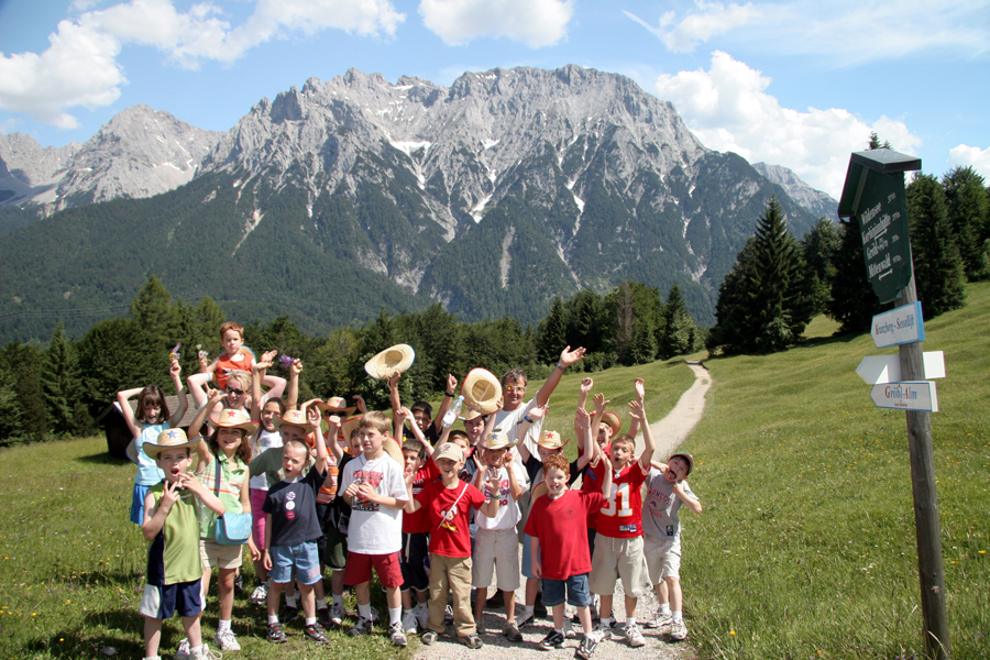 Kids Playing in front of a mountain