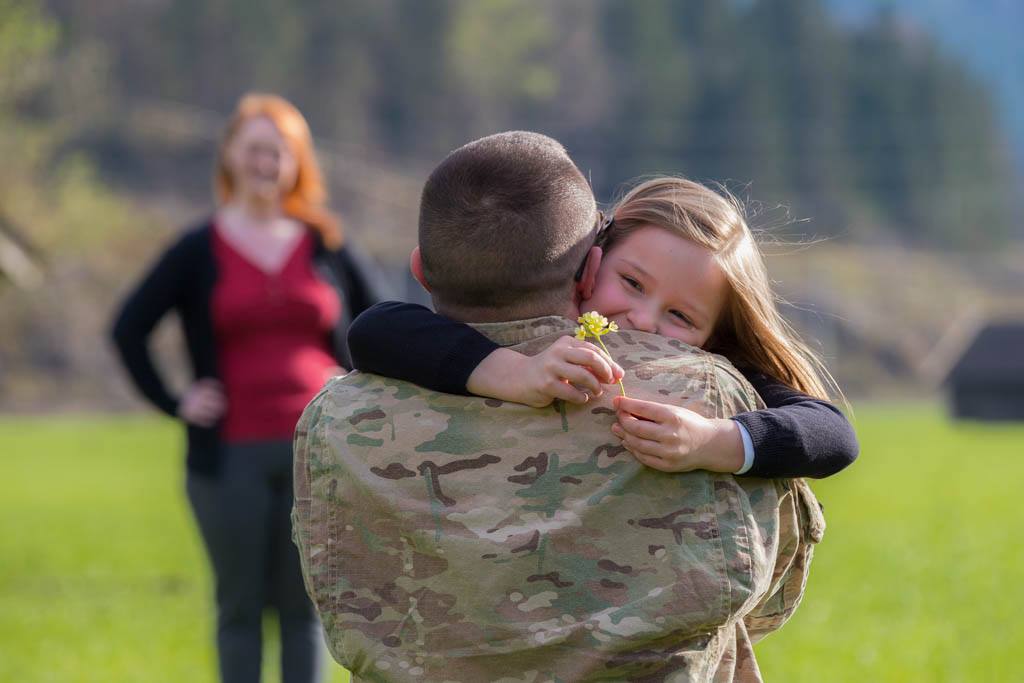 Dad hugging daughter