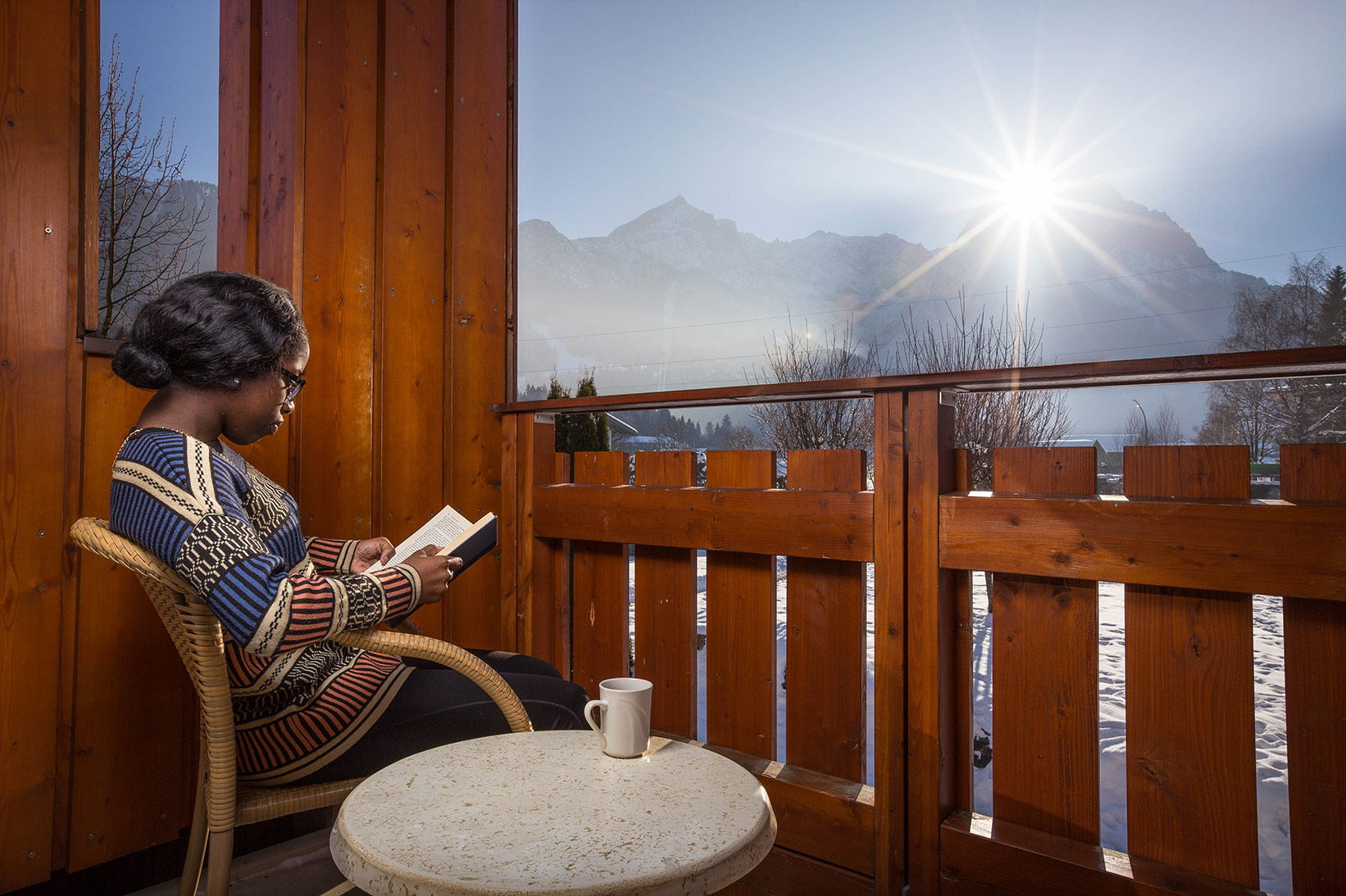 Woman reading on her balcony